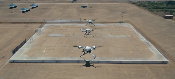 A drone flying over a military base